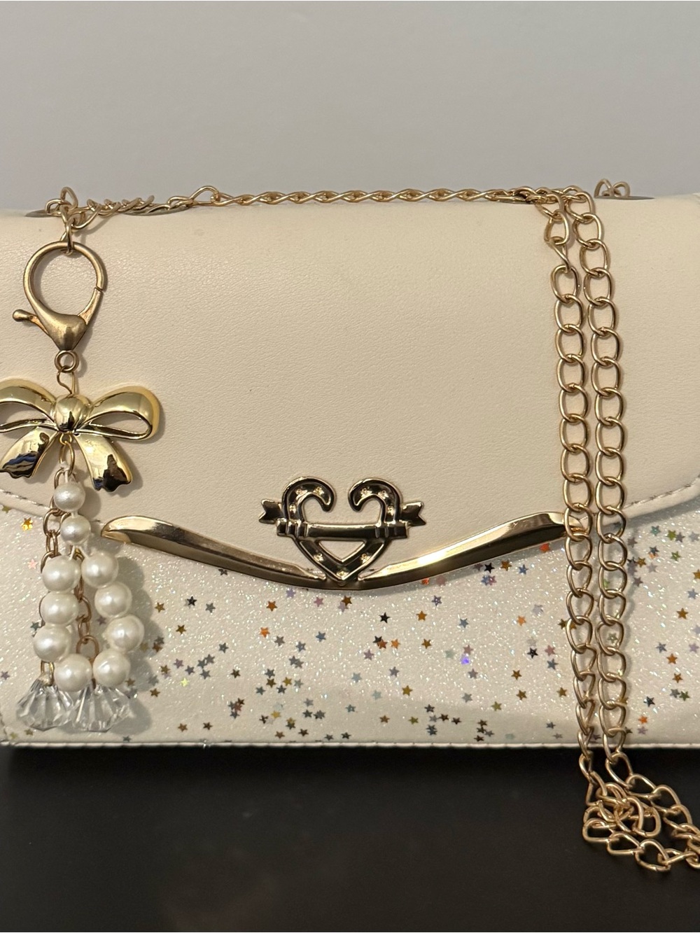 Cream Star-Accent Crossbody Bag with Gold Bow Charm
